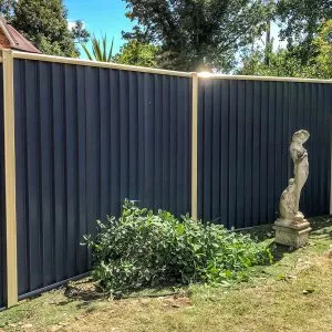 Blue Fence With Flat Caps & Cream Posts